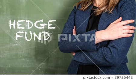 Hedge Fund. Business woman and green chalk board background Hedge Fund. Business woman and green chalk board background 89726448