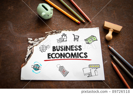 Business Economics concept. Burning sheet of paper on a rusty metal background 89726518