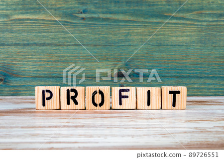 Profit. Text from wooden blocks on a white and green background 89726551