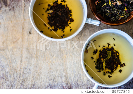 Cups of tea on vintage table Cups of tea on vintage table 89727845