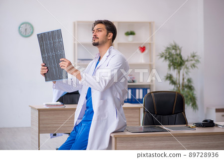 Young male doctor radiologist working in the clinic Young male doctor radiologist working in the clinic 89728936