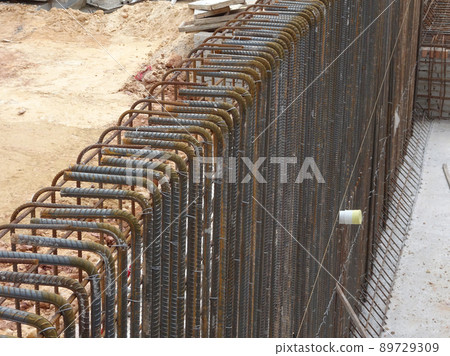 SELANGOR, MALAYSIA -MAY 3, 2022: Steel reinforcement bars for reinforced concrete construction have started to rust after being exposed to weather and water vapor. It can affect rebar if left untreate SELANGOR, MALAYSIA -MAY 3, 2022: Steel reinforcement bars for reinforced concrete construction have started to rust after being exposed to weather and water vapor. It can affect rebar if left untreate 89729309