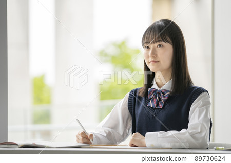 Female students taking classes 89730624