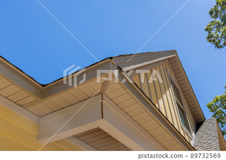 Aerial view the asphalt shingles roofing construction waterproofing for new house in covered corner roof shingles 89732569