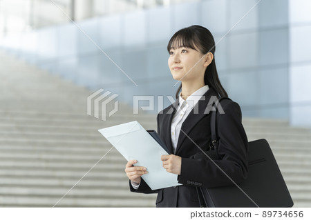 Image of a young woman in a suit Image of a young woman in a suit 89734656