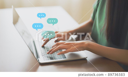 Woman using computer laptop on wood desk Woman using computer laptop on wood desk 89736383