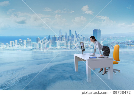 A business woman looking at the future with her hands on the desk in the business scene in the magnificent nature A business woman looking at the future with her hands on the desk in the business scene in the magnificent nature 89738472