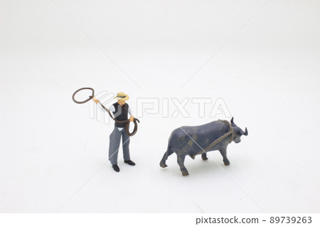 a Herding cattle, mini figure Cow boy spirit 89739263