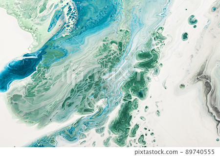 Fluid Art acrylic paints. Abstract mixing blue and green waves on white background. Liquid flows splashes. Marble effect background or texture Fluid Art acrylic paints. Abstract mixing blue and green waves on white background. Liquid flows splashes. Marble effect background or texture 89740555