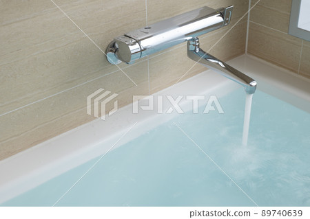 Bathroom with hot water in the bathtub 89740639
