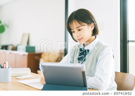 High school students studying online (tablet) High school students studying online (tablet) 89741692
