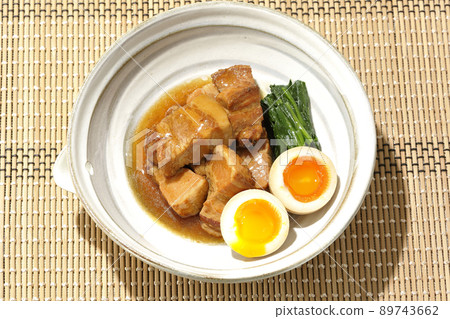 A bird's-eye view of boiled pork in a pot, soft-boiled egg and spinach 89743662
