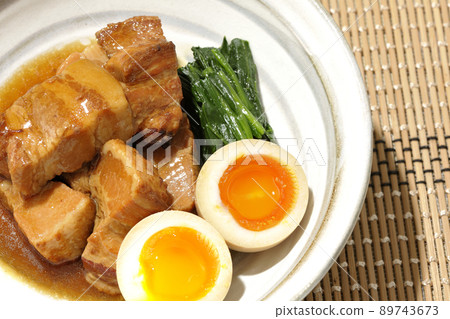 A bird's-eye view of boiled pork in a pot, soft-boiled egg and spinach 89743673