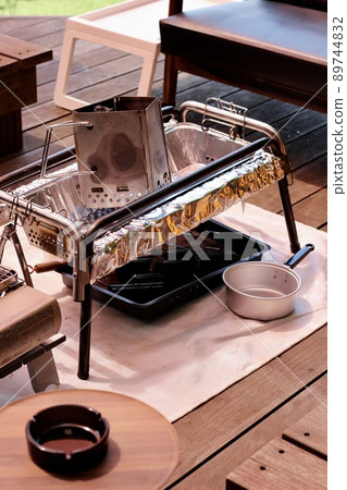 BBQ and preparation on the wooden deck of the house 89744832