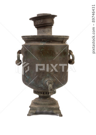 An old dirty Russian samovar in a cobweb. An old dirty Russian samovar in a cobweb. 89746431