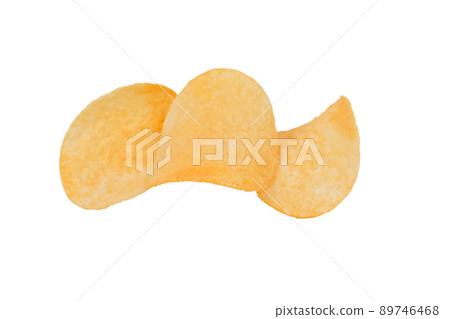 Three goldish deliciouse potato chips. 89746468