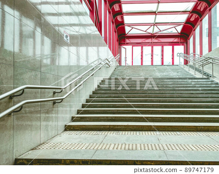 underground pedestrian crossing. safety of people on the road with cars. closed passage for the movement of people. high concrete stairs, comfortable metal railings 89747179