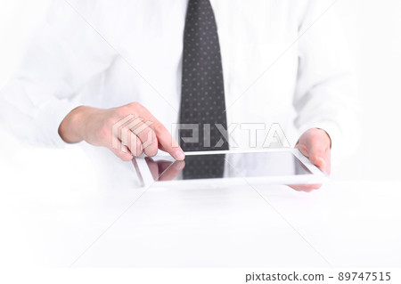 businessman pressing the screen of the digital tablet 89747515