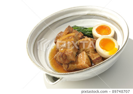 Kakuni pork in a pot, soft-boiled egg and spinach photographed on a white background Kakuni pork in a pot, soft-boiled egg and spinach photographed on a white background 89748707