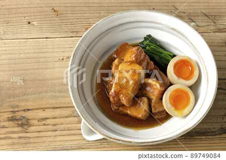 A bird's-eye view of boiled pork in a pot, soft-boiled egg and spinach 89749084
