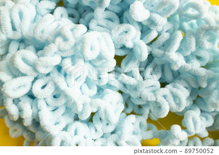 Soft yarn, delicate blue yarn. Handmade knitting as a hobby. 89750052
