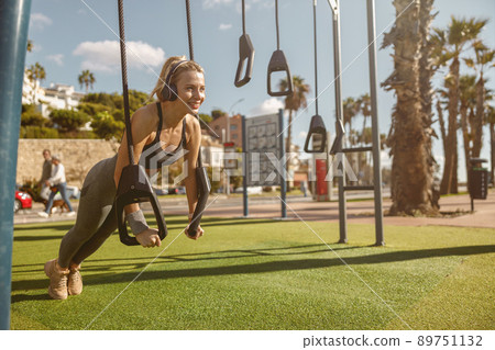 Photo of beautiful fitness woman on street workout Photo of beautiful fitness woman on street workout 89751132