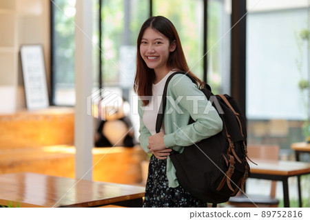 Young college student with backpack at class room. E-learning ,online ,education concept. 89752816