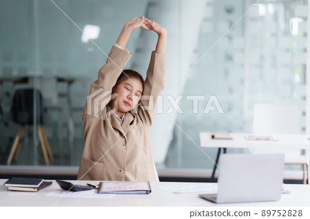 Portrait of Business or Accountant woman relaxing after hard work. Portrait of Business or Accountant woman relaxing after hard work. 89752828