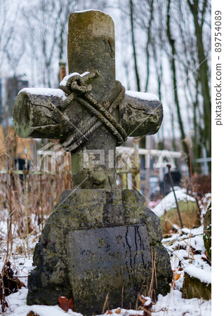 Massive stone cross at the ancient cemetery 89754089