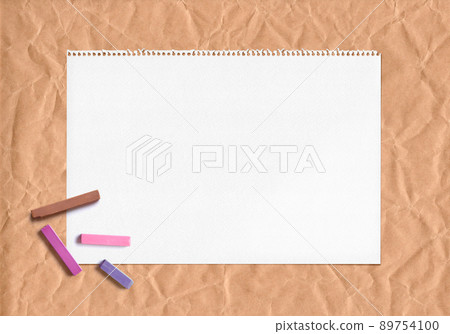 Kraft paper and sketchbook, warm pastel background Kraft paper and sketchbook, warm pastel background 89754100