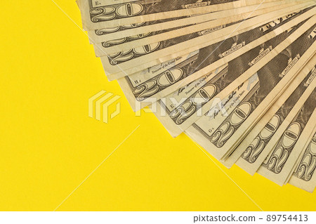 Big amount of old twenty dollar bills on yellow background. Money earnings, payday or tax paying period 89754413