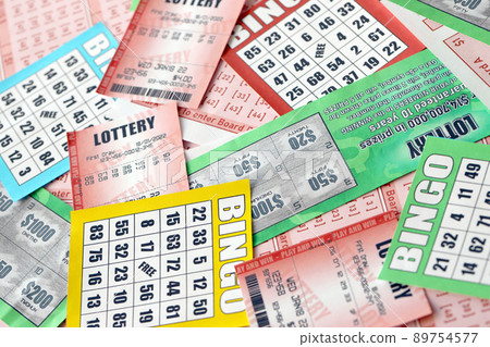 Many used lottery tickets, bills with numbers and bingo playing boards in big pile. Gambling and lottery paper stuff Many used lottery tickets, bills with numbers and bingo playing boards in big pile. Gambling and lottery paper stuff 89754577