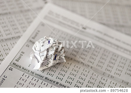 Crumpled lottery tickets as symbol of losing the lottery game. Unlucky gambling results. Misfortune Crumpled lottery tickets as symbol of losing the lottery game. Unlucky gambling results. Misfortune 89754628