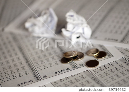 Crumpled lottery tickets as symbol of losing the lottery game. Unlucky gambling results. Misfortune 89754682