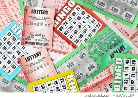 Many used lottery tickets, bills with numbers and bingo playing boards in big pile. Gambling and lottery paper stuff Many used lottery tickets, bills with numbers and bingo playing boards in big pile. Gambling and lottery paper stuff 89755194