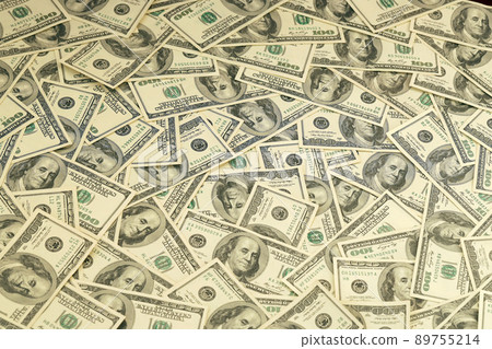 A pile of one hundred US banknotes with president portraits. Cash of hundred dollar bills, dollar background full frame image 89755214
