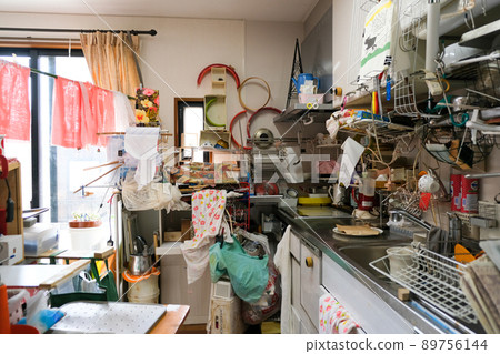 A messy kitchen with lots of things 89756144