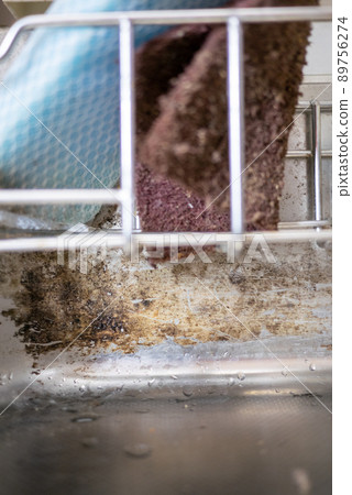 Kitchen sink with black mold that wasn't cleaned well 89756274