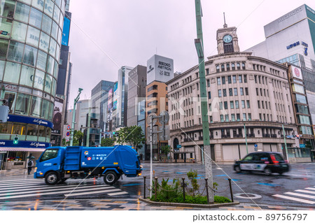 Tokyo cityscape of Japan Looking at the garbage trucks running at the Ginza 4-chome intersection in the early morning = May 13 Tokyo cityscape of Japan Looking at the garbage trucks running at the Ginza 4-chome intersection in the early morning = May 13 89756797