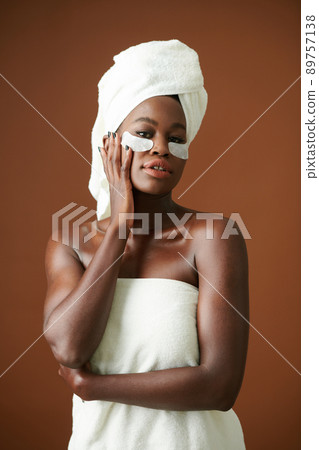 Woman Applying Hydrating Patches Woman Applying Hydrating Patches 89757138