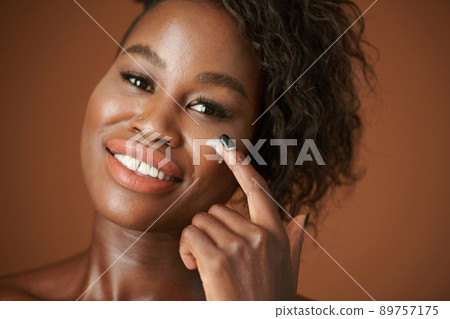 Woman Applying Face Cream 89757175