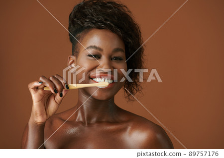 Excited Woman Brushing Teeth Excited Woman Brushing Teeth 89757176