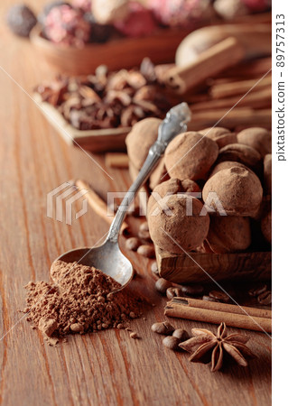 Chocolate truffles on a wooden table. Chocolate truffles on a wooden table. 89757313