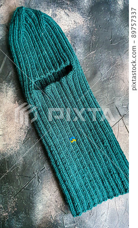Handmade balaclava with Ukrainian symbols. Knitted from gray and green threads. Warms, reliably saves from the cold. 89757337