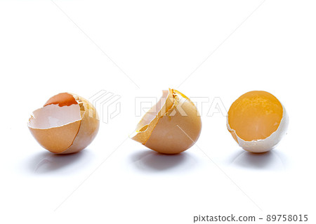 three eggshell fresh broken chicken egg halves with shadow isolated on white background with copy space, leftover ingredients for cooking protein food. 89758015