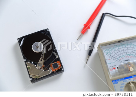 Analog tester and disassembled hard disk drive 89758111