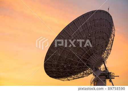 Huge Satellite Dish in evening twilight sky at sunset 89758590