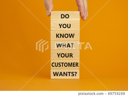 Support your client symbol. Concept words Do you know what your customer wants on wooden blocks on a beautiful orange background, copy space. Businessman hand. Business, support your client concept. 89759289
