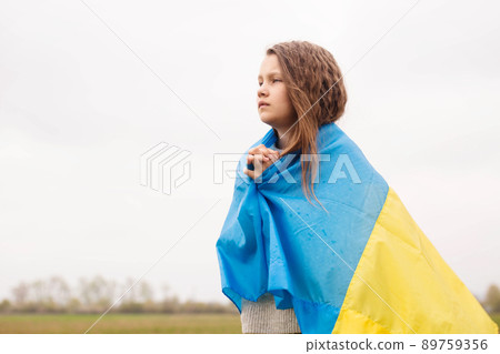 girl with the flag of Ukraine prays 89759356