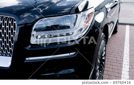 headlight of prestigious black car headlight of prestigious black car 89760416